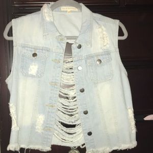 Ripped jean jacket with no sleeves